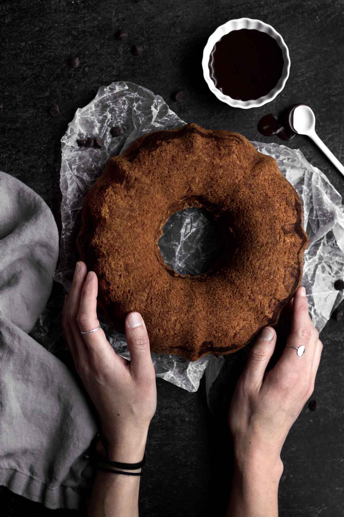 Round brown bundt cake fresh out of the oven.