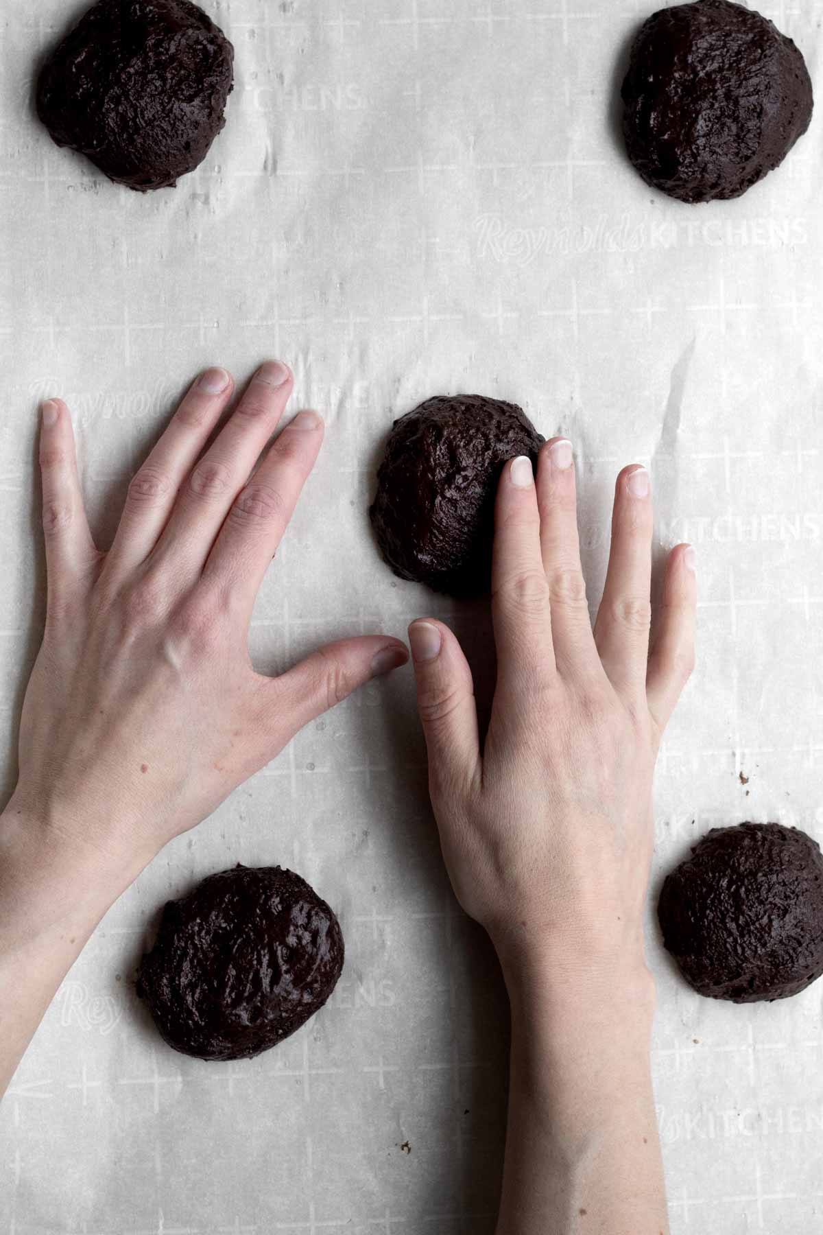 Patting down the batter into domes.