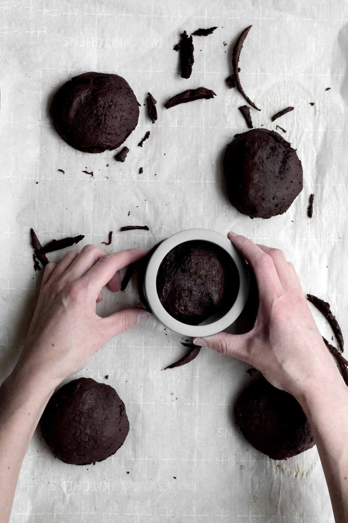 Using a circular cookie cutter to shape the Whoopie Pie cakes.