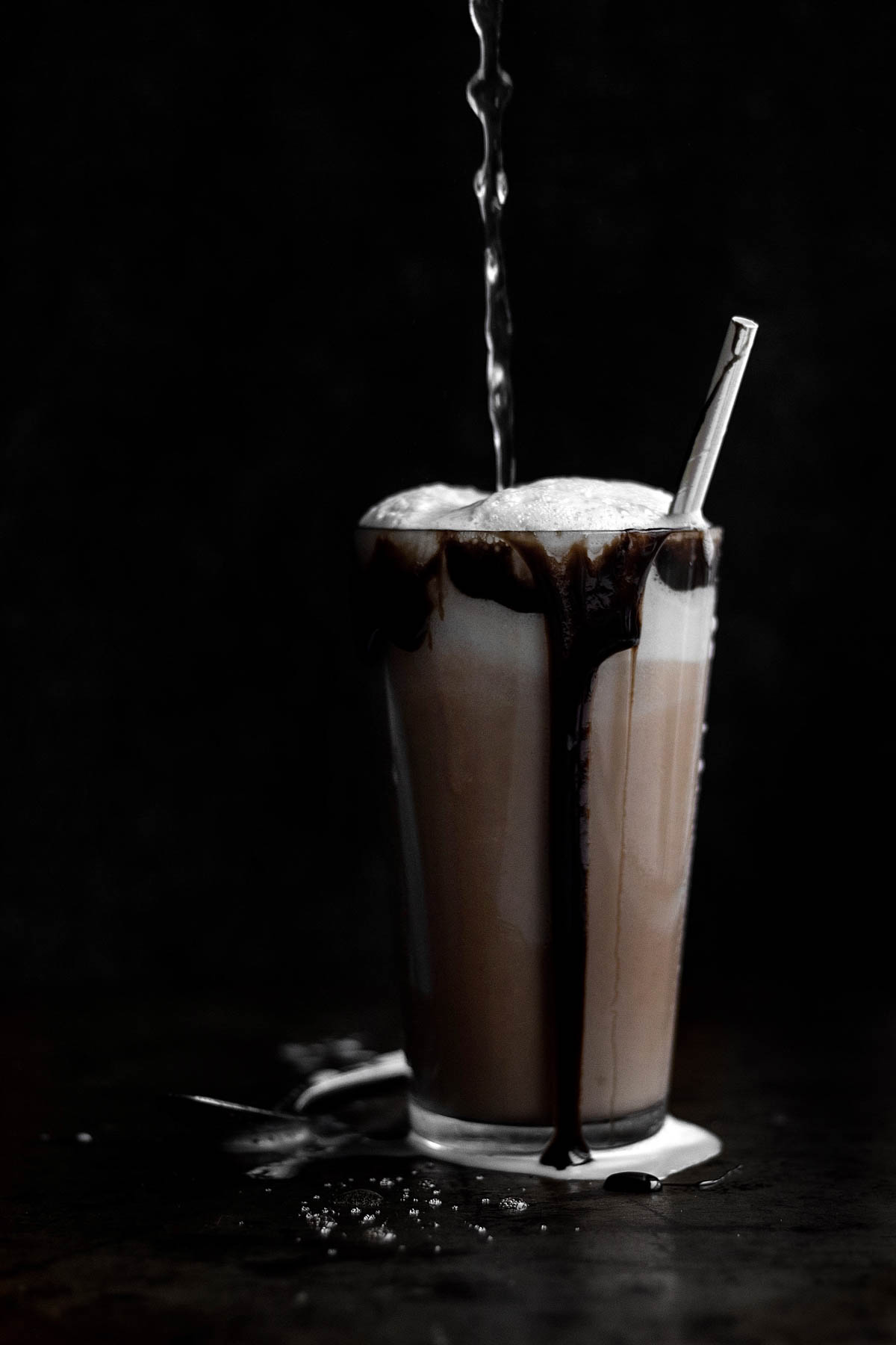 Pouring Seltzer into an overflowing New York Chocolate Egg Cream.