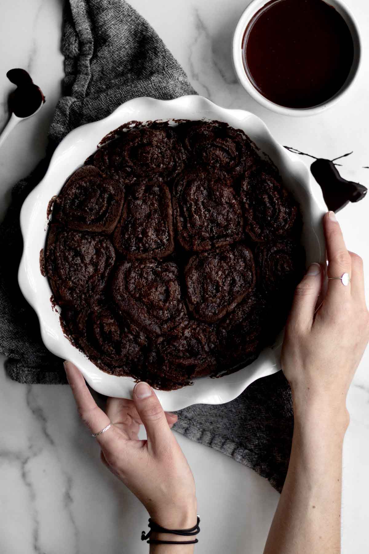 Chocolate Cinnamon Rolls in a dish, hot out of the oven.