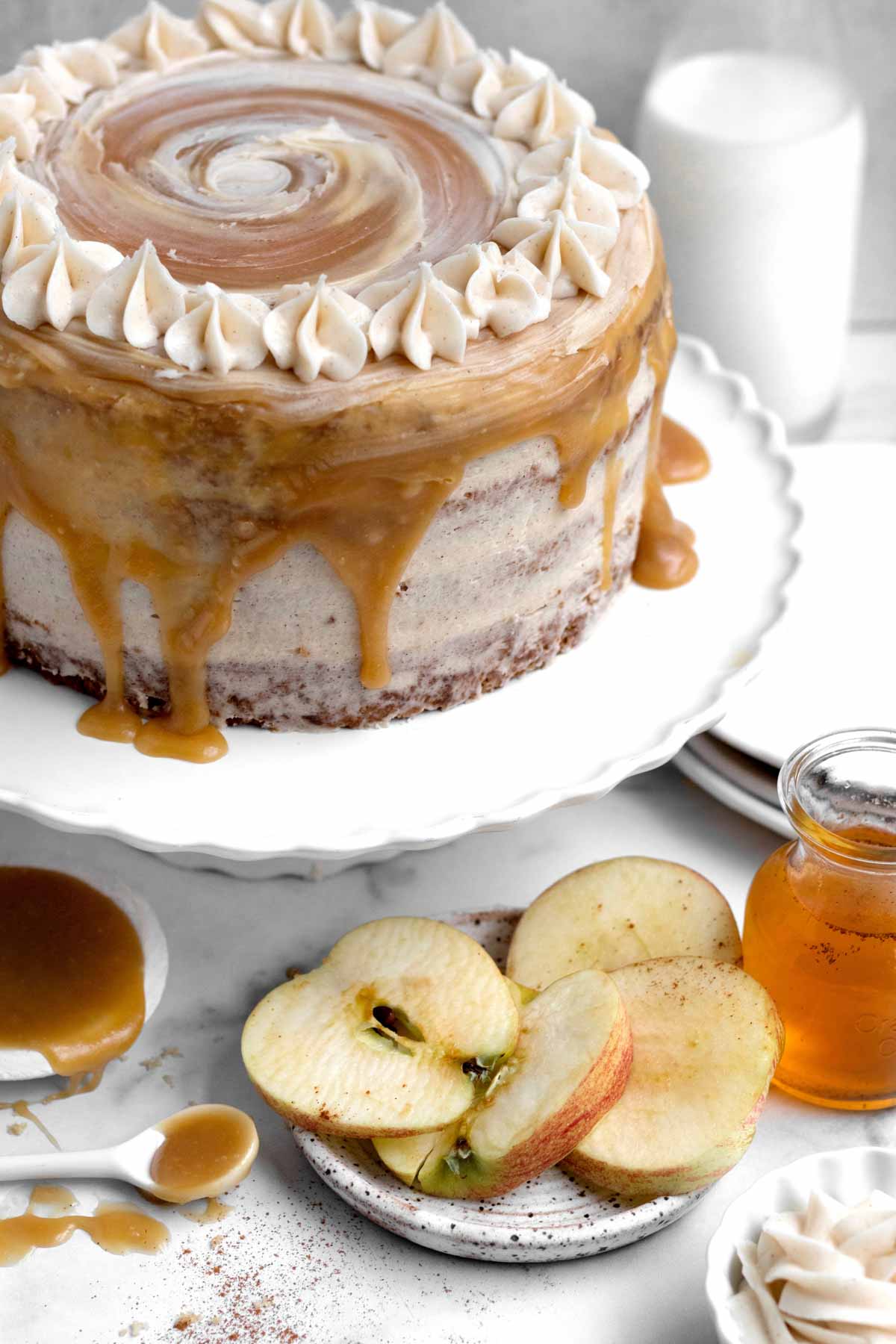 The cake sits dripping with an apple cider caramel swirl.
