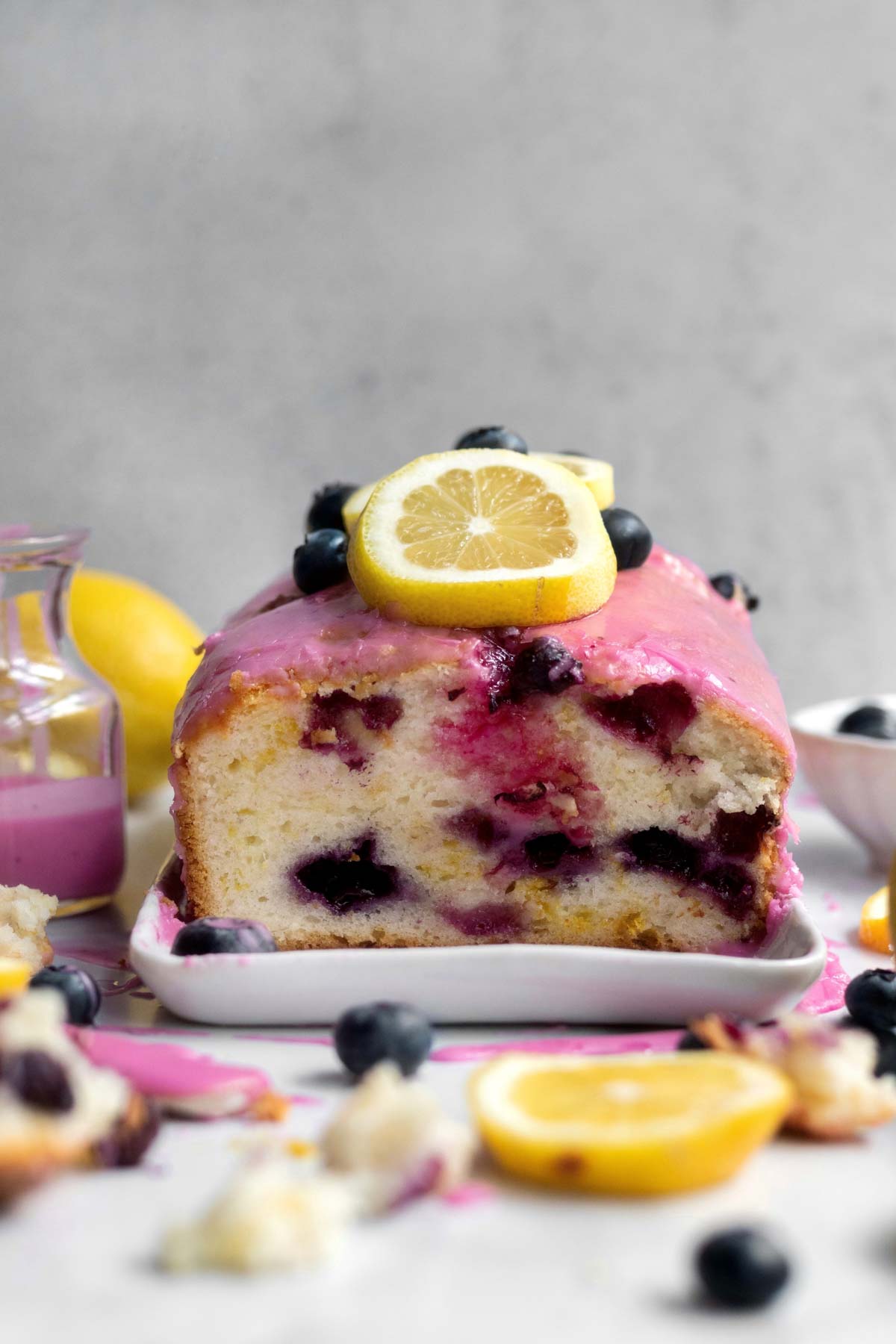 Blueberry Lemon Loaf cut in half showing the blueberry stained insides.