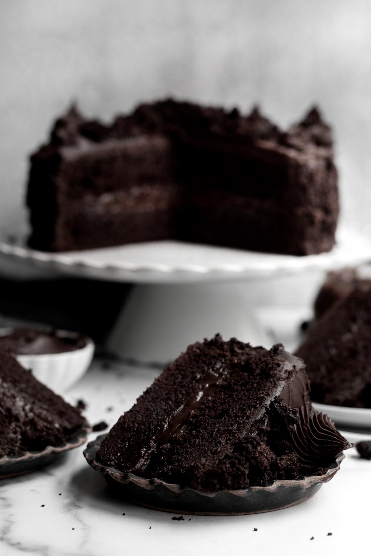 A slice of Brooklyn Blackout Cake sits apart from the whole.