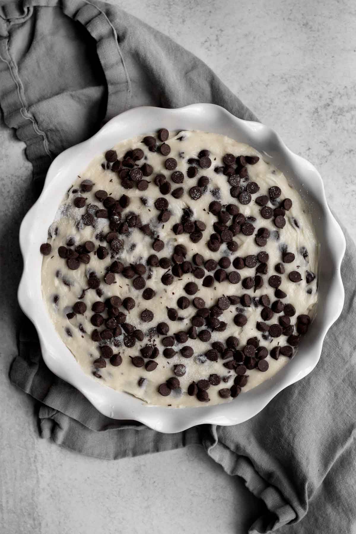 Vanilla batter dotted in chocolate chips.