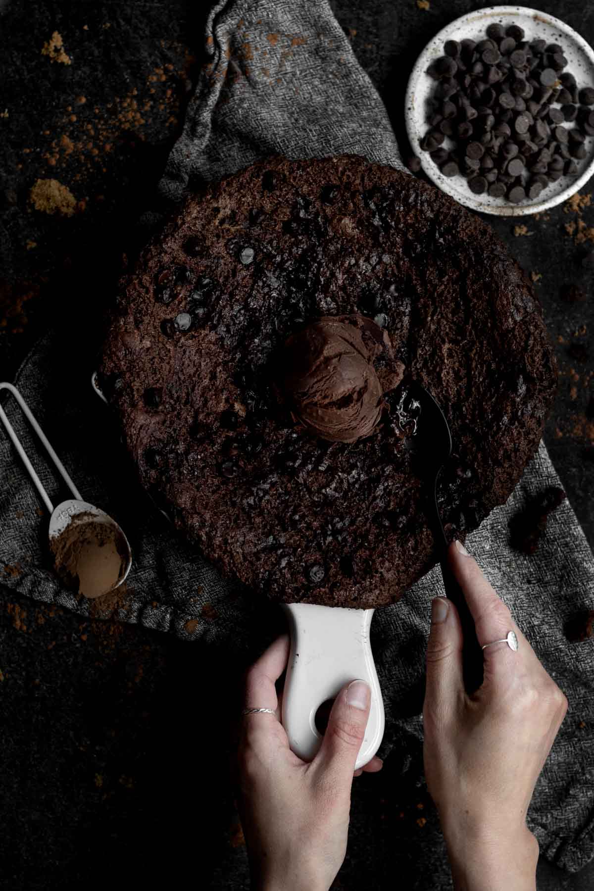 Chocolate Cobbler in a crock topped with chocolate Ice Cream.