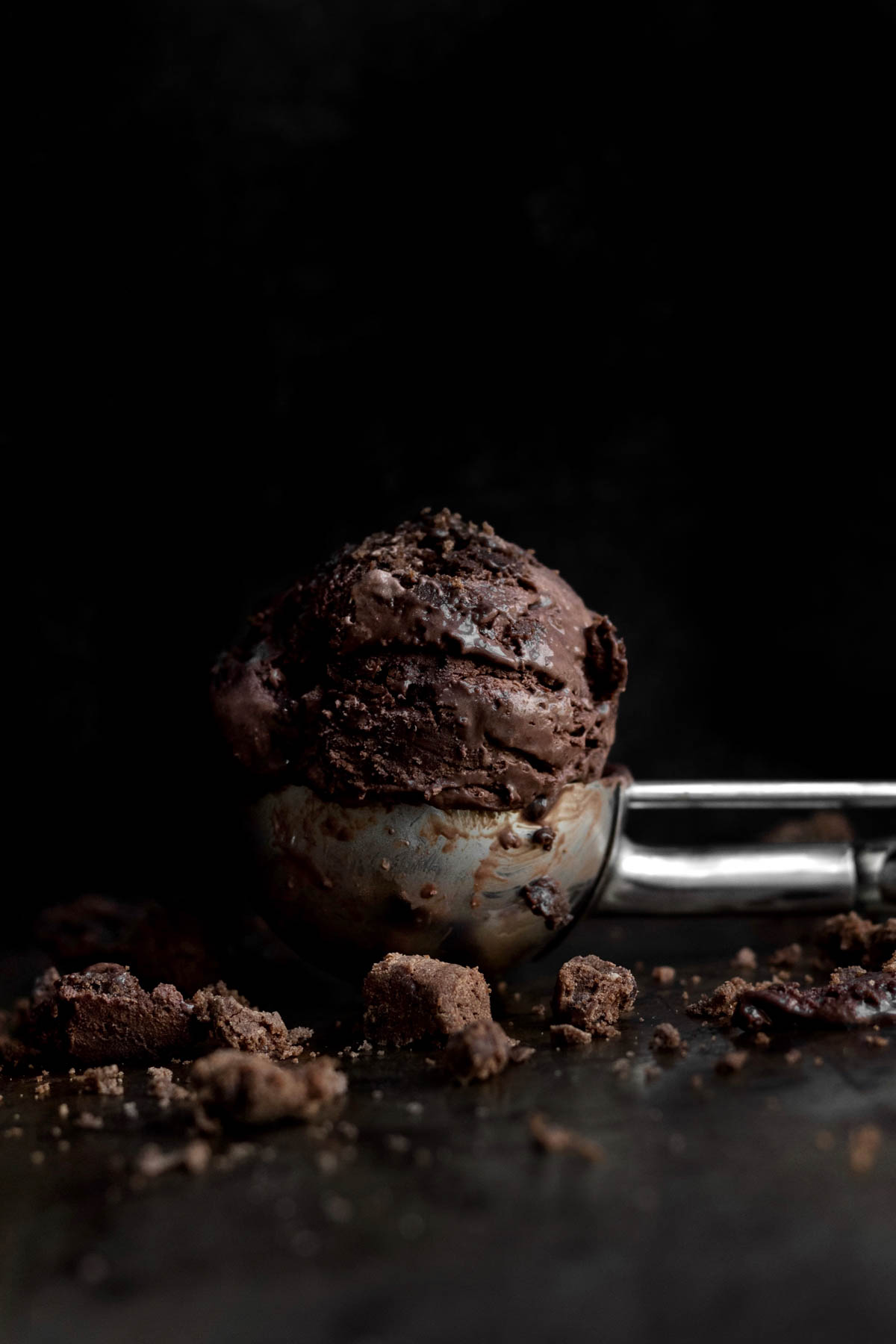A scoop with No Churn Chocolate Cookie Ice Cream.