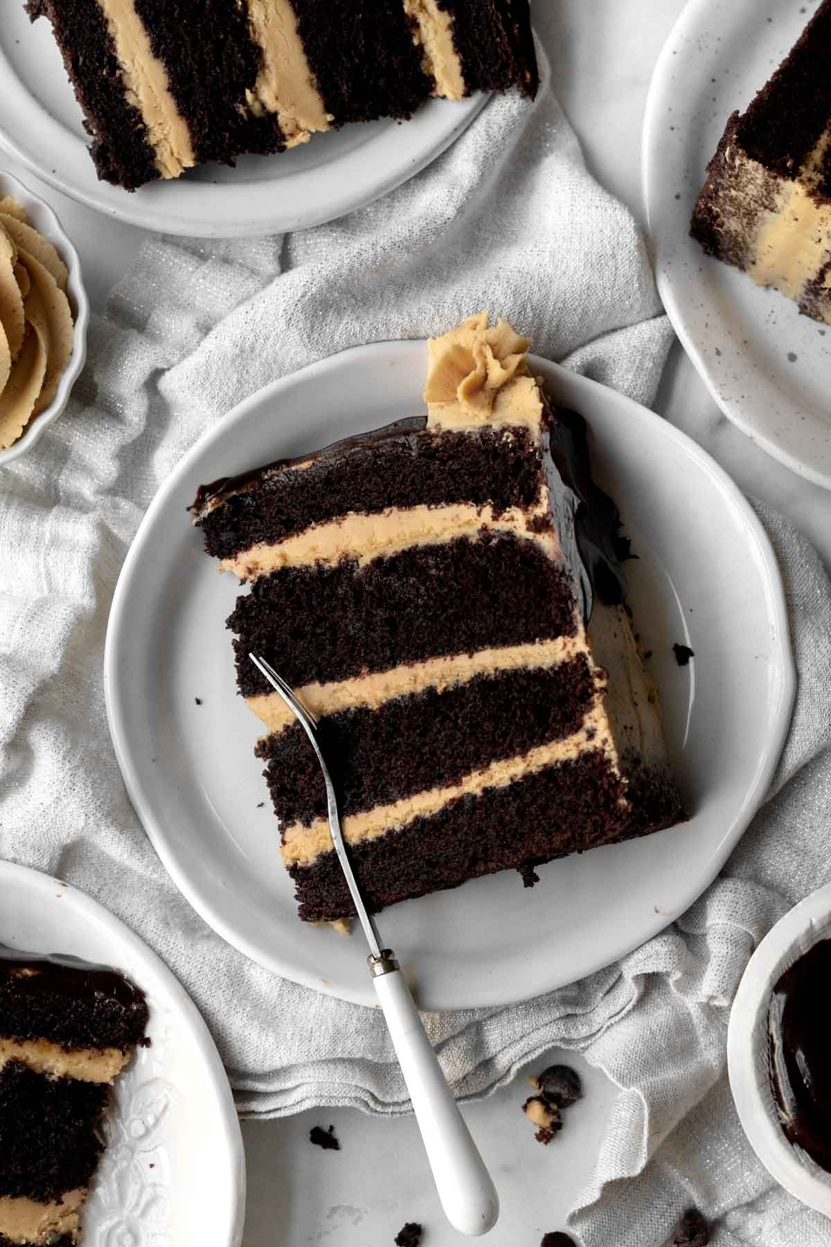 A fork cuts the layers of chocolate cake and Wow Butter buttercream.