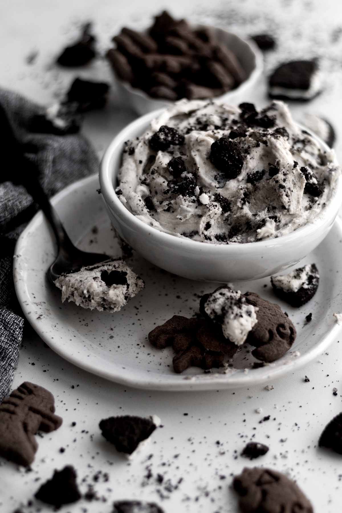 A bowl with chocolate cookie crackers and Oreo Dip.