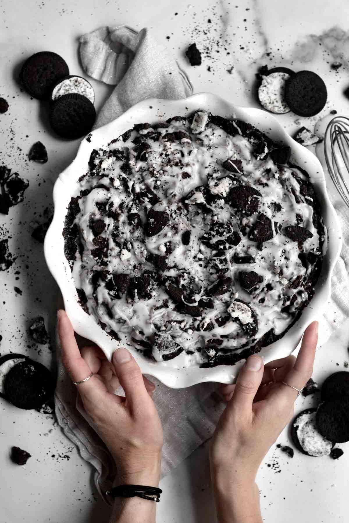 Cookies and Cream Cinnamon Rolls in a round baking dish.
