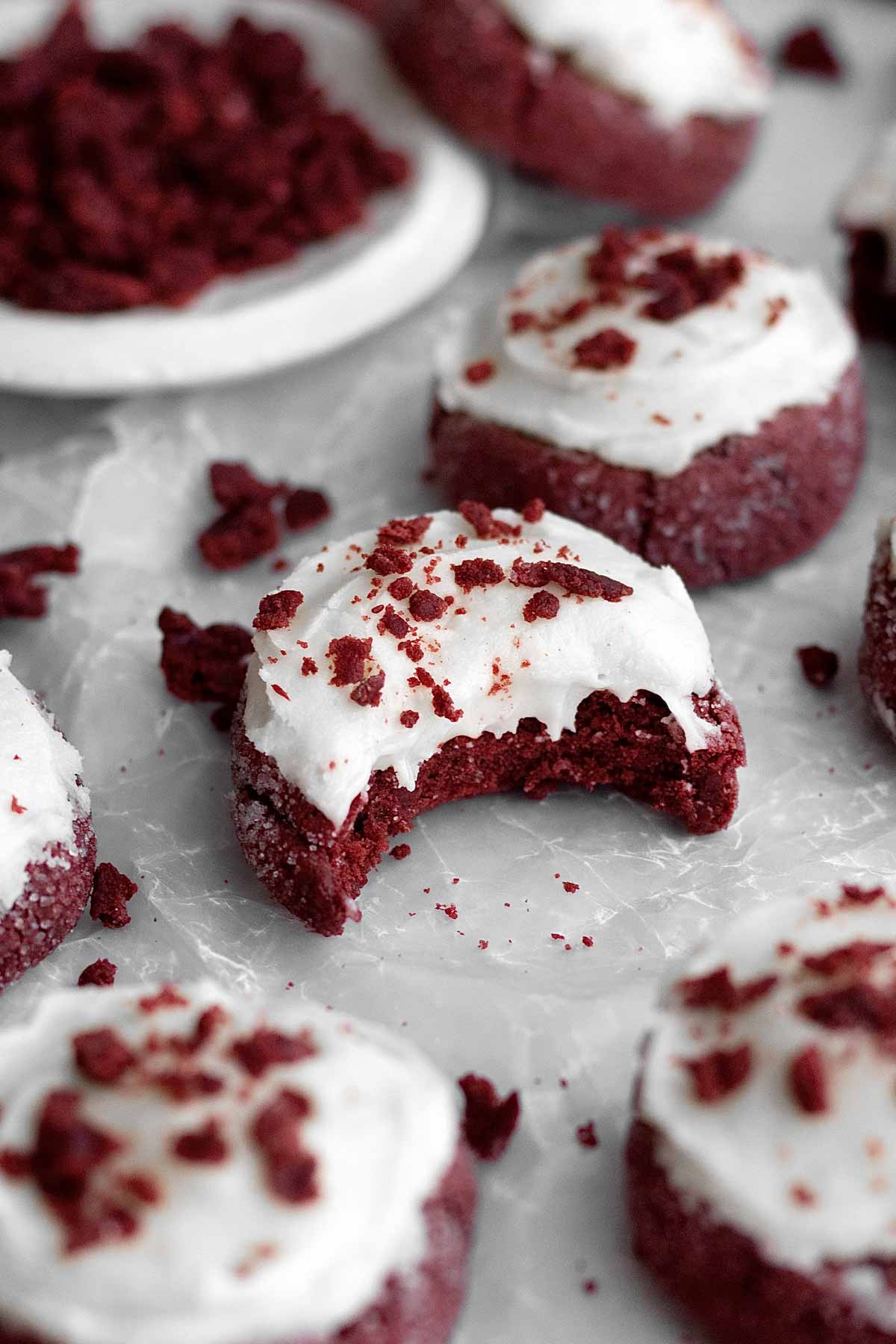 Someone took a bite out of this Frosted Red Velvet Cookie.