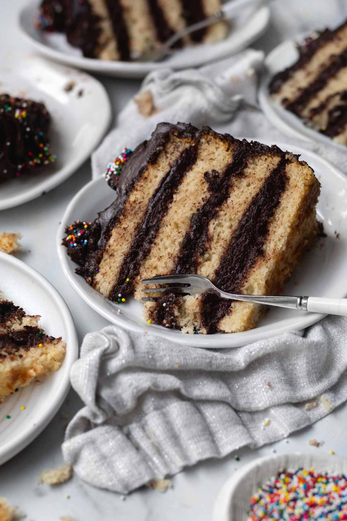 A fork takes a bit of a slice of the cake.