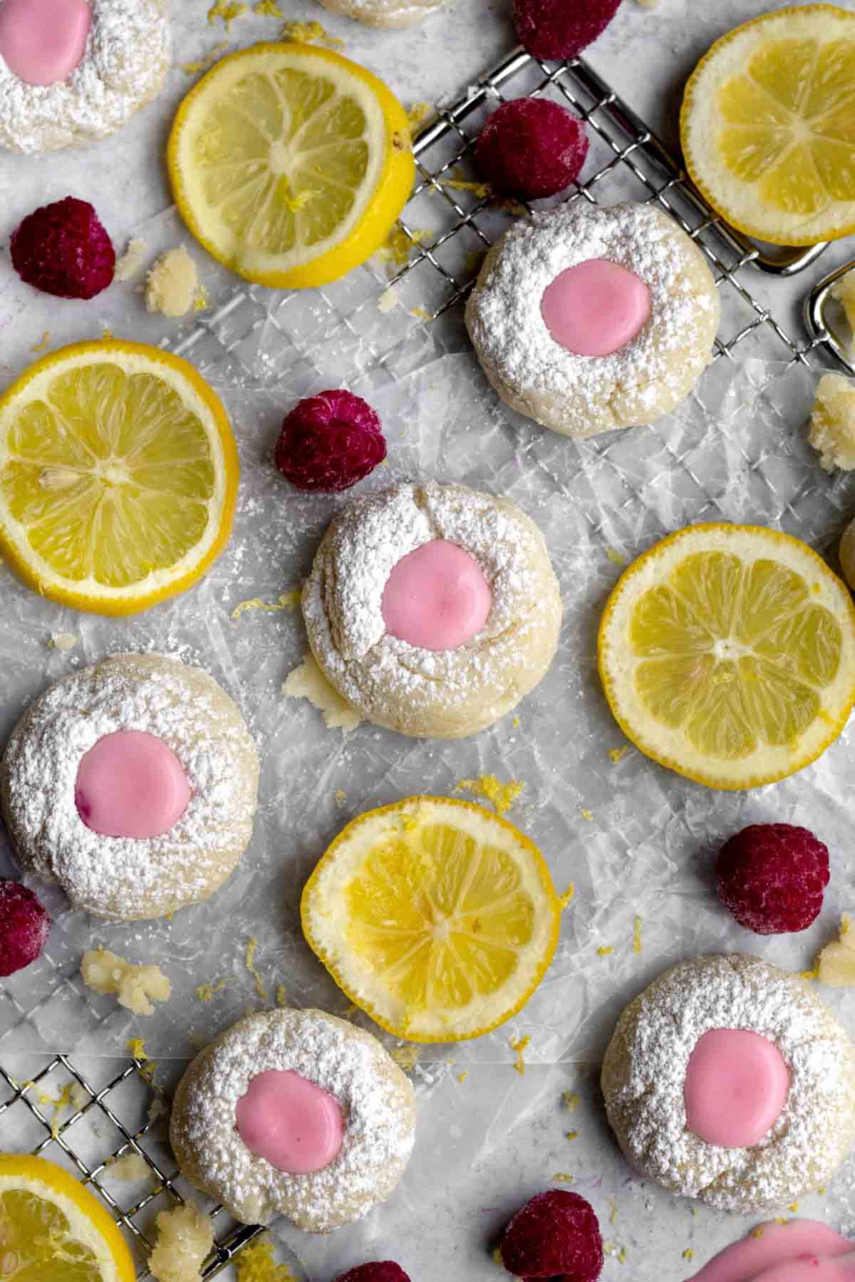 Raspberry Lemonade Cookies with fresh raspberries and round lemon slices.