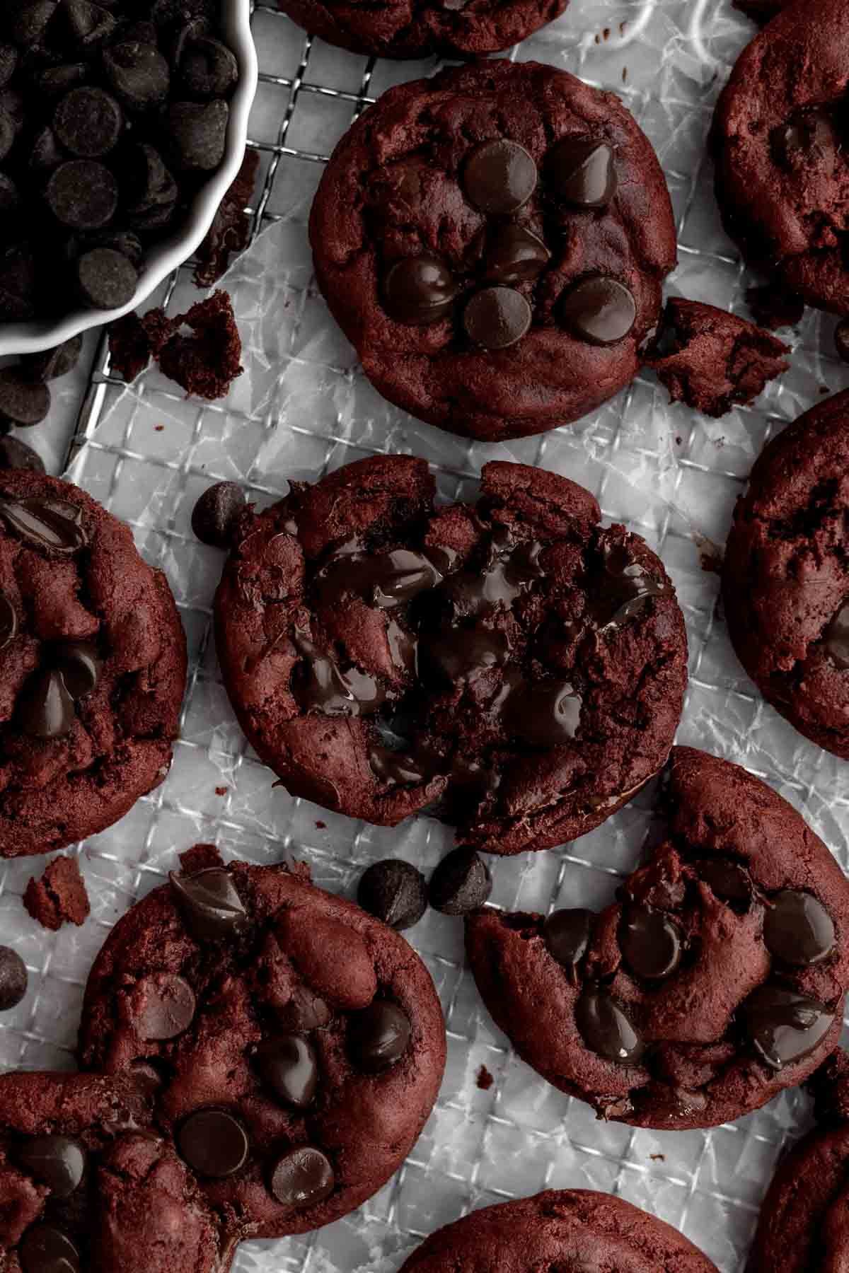 Hot gooey chocolate spreads from this divided Red Velvet Chocolate Chip Cookie.