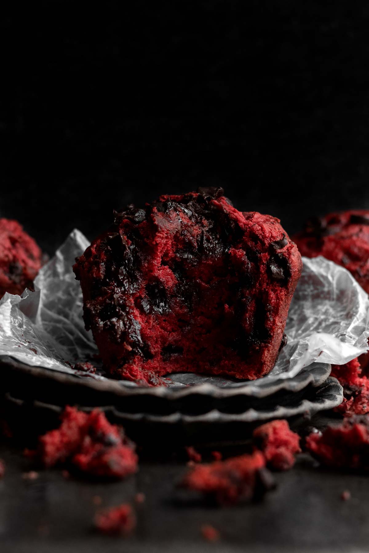 This delicious Red Velvet Muffin is bitten in half.