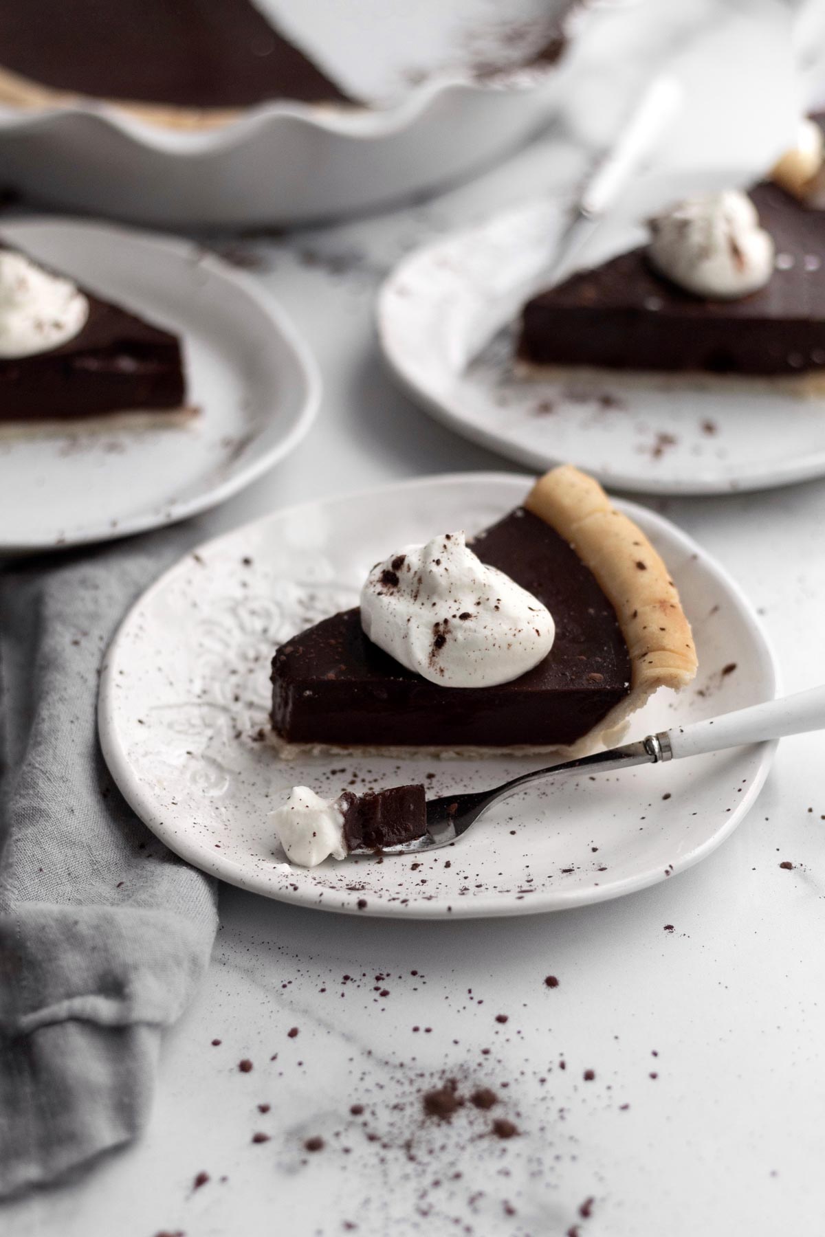 Vegan Chocolate Pudding Pie with a dollop of whipped cream.