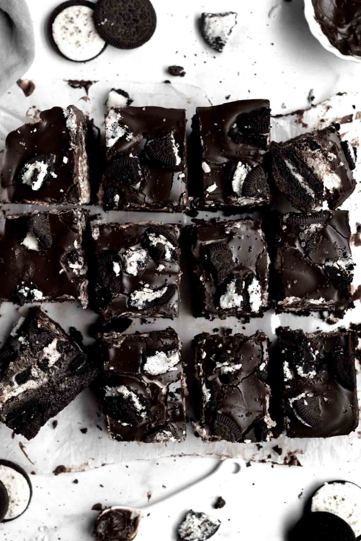 Cut up rectangular portions of Vegan Cookies & Cream Brownies.