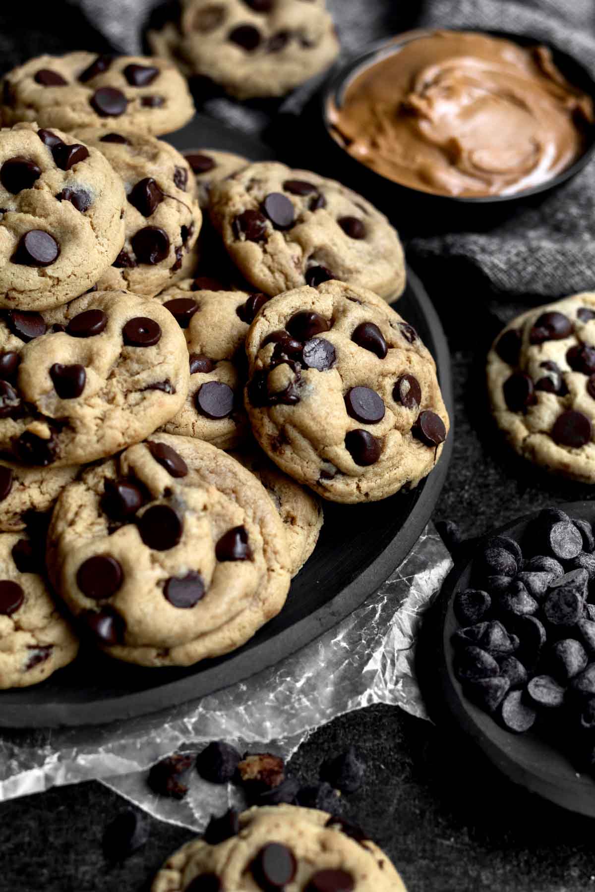 A black plate full of Wow Butter Chocolate Chip Cookies.